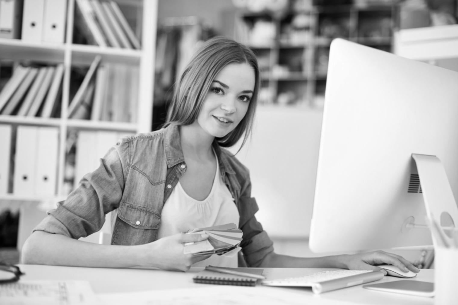 Person reviewing financial documents and notes on a desk